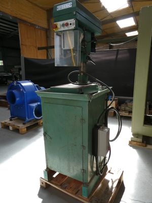a machine that is sitting on a pallet in a warehouse
