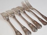 a lot of forks and spoons that are on the table
