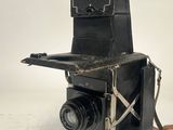 an old camera that is sitting on a table