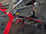 many bikes that are sitting on the floor in the gym