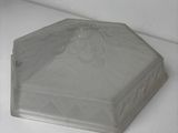 a plastic container with a lid on a white surface