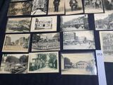 several old black and white photographs of people and buildings on display