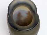 an image of a vase with a brown and black design