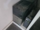 a computer that is sitting in the corner of the room