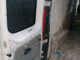 a white van with the door open on the side of the road