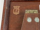 a picture of a wooden box with a clock inside of it