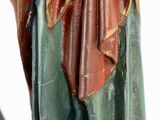 an image of a statue of a woman holding a baby in her arms