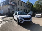 a white suv parked in front of a building