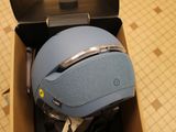 a box with a helmet inside of it on the floor