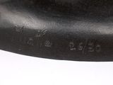 a close up of a black object on a white surface