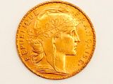 an image of a gold coin with a woman ' s head on it