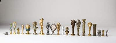 a lot of different types of trophies on a white surface