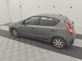 a picture of a small car parked in a garage