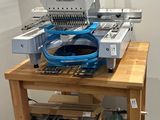 a machine that is sitting on top of a wooden table