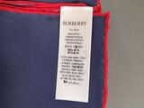 a blue and red pocket square with a tag on it