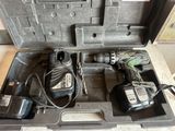 two tools in a case that are sitting on the floor