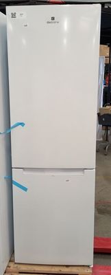 two white refrigerators stacked on pallets in a warehouse