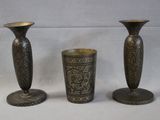 three vases sitting next to each other on a table