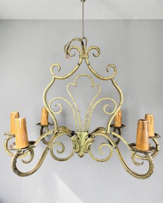 a chandelier hanging from the ceiling in a room
