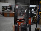 a fork lift truck in a warehouse with other equipment