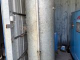 a water heater that is next to a blue machine