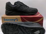 a pair of black shoes sitting on top of a box