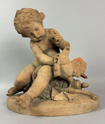 statue d'un garçon assis sur un rocher, tenant un oiseau dans ses mains