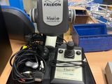an image of a microscope sitting on top of a wooden table