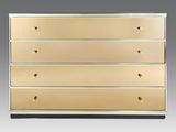 a gold chest of drawers on a grey background