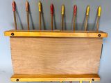 a wooden box with eight wooden crochets in it