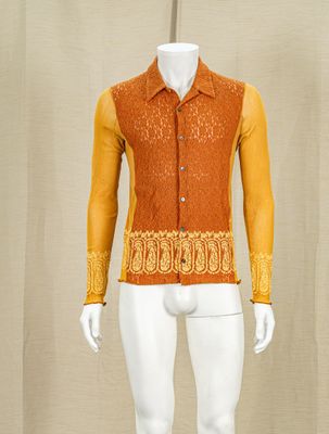 an image of a mannequin dressed in orange and yellow