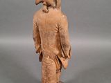 statue of a man with a bird on his head