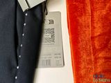 a tag on a shirt that is attached to a tie