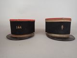 pair of black and gold hats with numbers on them