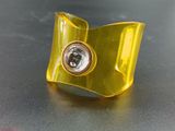 gold plated ring with a diamond in the center on a black surface