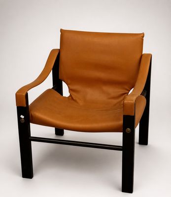 an image of a brown leather chair on a white background