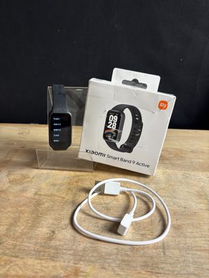 an apple watch and a charger sitting on a table