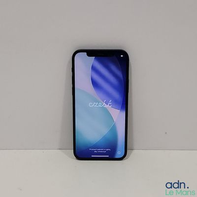 the back of a black iphone x sitting on top of a white table