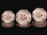 four plates are stacked on top of each other on a black surface
