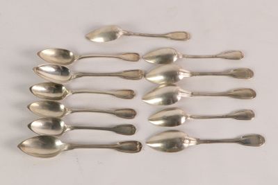 six silver spoons are arranged in a row on a white surface
