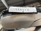 a sticker that says vauto on the side mirror of a car