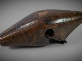 an old wooden object with a hole in the middle of it