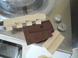 a piece of chocolate sitting on top of a machine