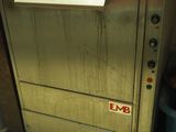 a metal door with a sign on it that says emb