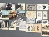 a wall full of old photos and postcards on the wall