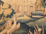 an image of a tapestry with birds and plants in the foreground
