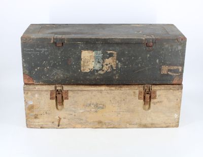 two trunks stacked on top of each other on a white surface