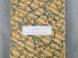 an image of a yellow and green notebook with a label on it