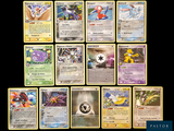 a lot of pokemon cards that are on the table