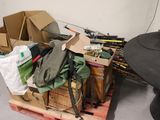 a pile of assorted items on a pallet in a room